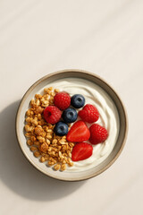 Yogurt bowl with granola and fresh berries