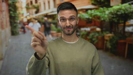 Young hispanic man rejects with gestures on a bustling city street, surrounded by urban outdoor...