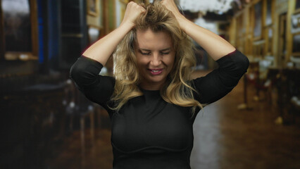 Woman expressing emotion with hands on head in a church setting, showcasing stress and relief through facial expressions indoors.