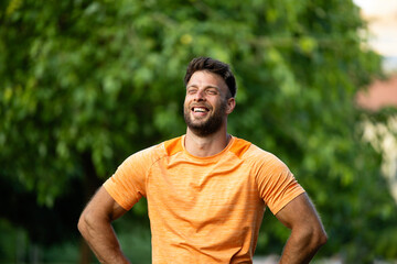 Professional sportsman gaining motivation and preparing for running training outdoors.