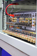 Rear panel of a high-quality AV receiver with multimedia connections for connecting speakers, analog and digital signals. 
