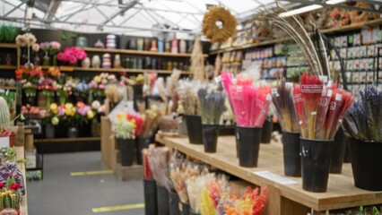 Blurred florist display with colorful flowers and plants in focus, showcasing a vibrant assortment...