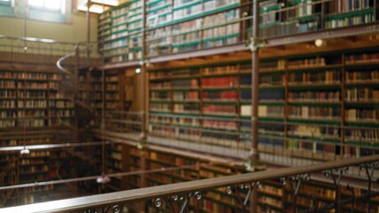 Blurred view of a classic library's interior with shelves filled with old books, creating a defocused ambiance perfect for vintage and educational themes.