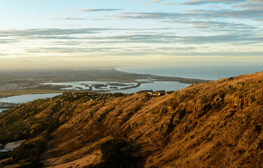 View of Port Hills at sunset. Canterbury. South Island of New Zealand.