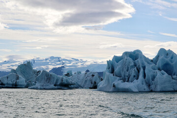Iceland-Iceberg in Jokulsarlon Glacier Lagoon with the Vatnajokull glacier in the background  