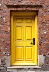Old yellow door, brick wall background, home renovation