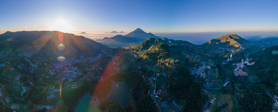 Panoramic Aerial Photo of Dieng Plateau Featuring Mount Prau, Sikunir Hill, Bismo Mountain, and Twin Lakes