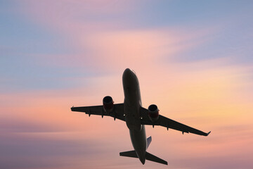 Airplane in the sky, over the cloudy sky , vacation holidays travel tourism

