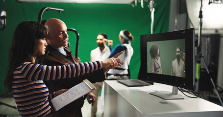 Man, director and producer with green screen for scene playback, action or recording in studio....