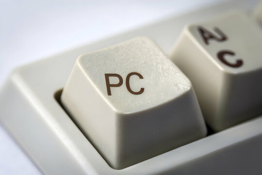 PC Keycap Closeup: An extreme close-up of a PC keycap, the focus is on the letters, providing a detailed view of the keys, hinting at the world of computing.