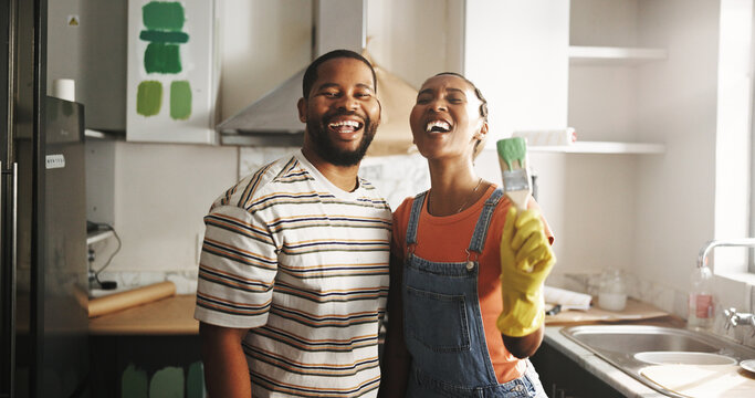 Painting, remodeling and portrait of black couple in home for diy, renovation and creative project. Interior design, kitchen and happy man and woman with paintbrush for decor, makeover and upgrade