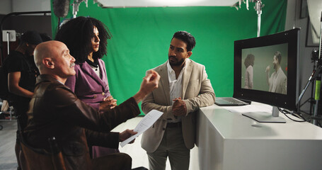 Man, director and discussion with actor for script, instructions or guideline on production set....