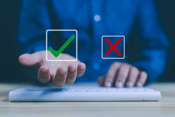 Businessman thinking and deciding between right and wrong symbols. Voting decision. Yes or no...
