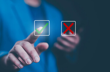 Businessman thinking and deciding between right and wrong symbols. Voting decision. Yes or no...
