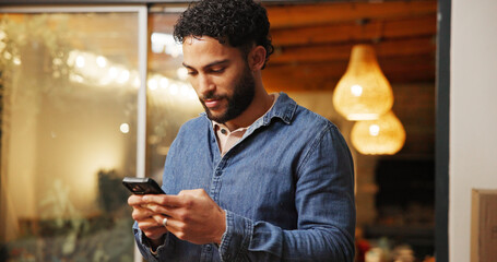 Phone, smile and man in coffee shop with networking, communication or connectivity in mobile app....