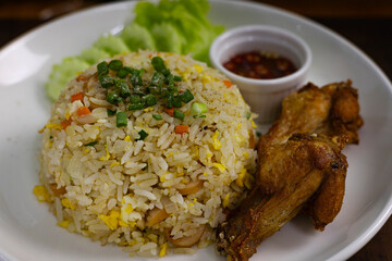 Fried Rice With Egg And Fried Chicken On Plate