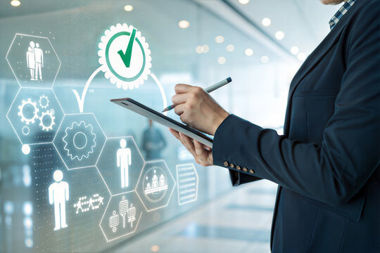 Business professional reviewing digital interface with human resource and process icons - Powered by Adobe