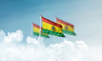 Bolivia national flags with mast waving in beautiful clouds. Bolivia flag for Republic Day and Independence Day.