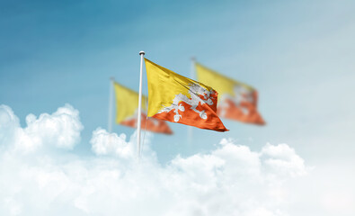 Bhutan national flags with mast waving in beautiful clouds. Bhutan flag for Republic Day and...