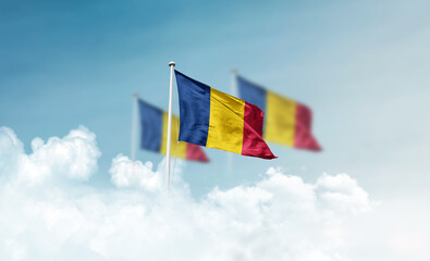 Chad national flags with mast waving in beautiful clouds. Chad flag for Republic Day and...