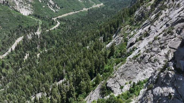 Aerial Little Cottonwood Canyon along granite mountain Utah 1 4. Wasatch Mountain Range central Utah, outside of Salt Lake City, Utah. Winter and summer recreation. Landscape scenic and rugged. Cliff.