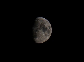 Waxing gibbous moon in dark night sky