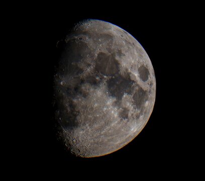 Waxing gibbous moon in dark night sky