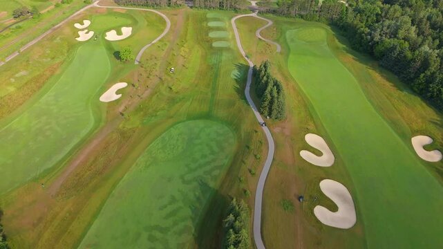 Aerial: TPC Toronto at Osprey Valley Golf Course during the day in Alton, Caledon, Ontario, Canada, dolly in drone shot