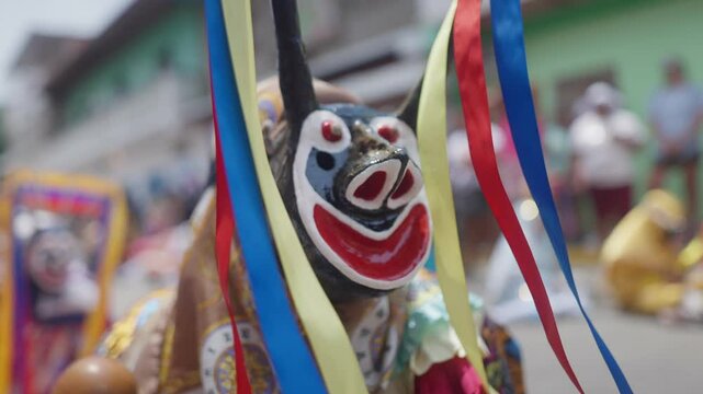 Close up in slow motion of the Traditional mask of a Dancing Devil in a religious celebration
