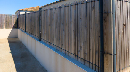 home wood steel palisade long wooden fence planks to hide the neighbor from garden house