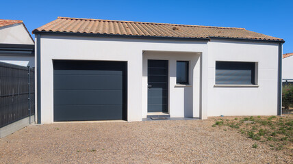 facade modern new white house front entrance of suburban home building with gray aluminum black dark grey door windows garage 