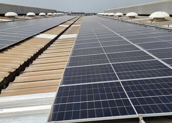 The perspective of PV Solar Rooftop installation on the factory roof.