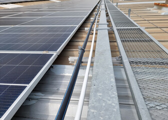 Solar rooftop system installation, HDPE water pipe, wireway, walkway on the factory roof.