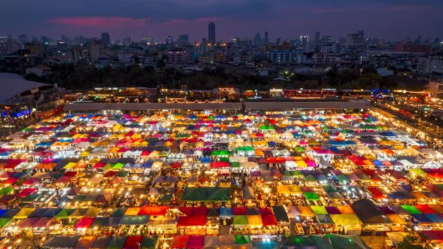 Time lapse video from dusk to night view of the Train Night Market Ratchada, Bangkok, Thailand