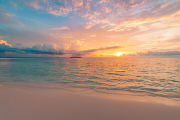Stunning closeup tropical beach with calm waves golden orange sky soft light sea sand horizon...