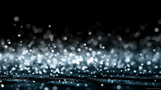 Shimmering glittering bokeh lights sparkling across dark background for festive or luxury visual effect