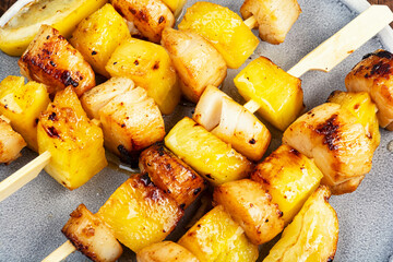 Roasted or fried scallops with pineapple pieces