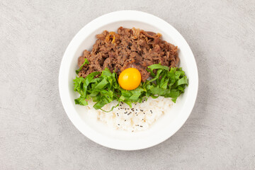 Bulgogi rice bowl is a dish made by marinating and grilling lean meat over a fire and then placing...