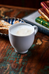 Cappuccino on dark wooden background. Soft focus. Close up.	