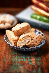Cantuccini (Italian cookies) on dark wooden background. Close up	