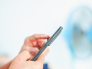 Close up hand people using smartphone browsing internet, business, text or online shopping. Senior...