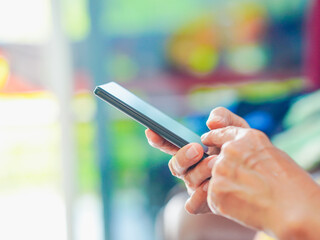 Close up hand people using smartphone browsing internet, business, text or online shopping. Senior...