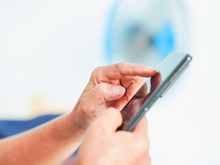Close up hand people using smartphone browsing internet, business, text or online shopping. Senior...