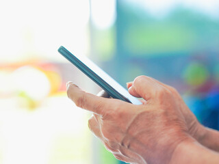 Close up hand people using smartphone browsing internet, business, text or online shopping. Senior...