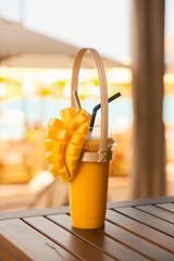 Fresh mango smoothie. Tropical drink, diced mango topping. Healthy, vibrant, fruit beverage. Summer...
