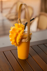 Fresh mango smoothie. Tropical drink, diced mango topping. Healthy, vibrant, fruit beverage. Summer...