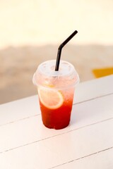 Refreshing strawberry soda with lemon slice. Sweet, fizzy drink. Summer beverage. Cold, red soda. Fruit drink.