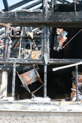 A building is on fire and has been destroyed