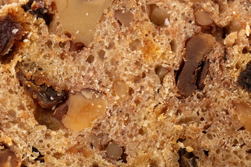 Rustic festive bread with walnuts and raisins. Close-up. Easter.