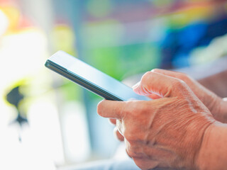 Close up hand people using smartphone browsing internet, business, text or online shopping. Senior...